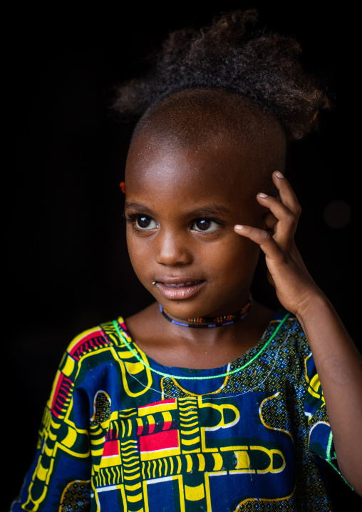 Portrait of a Peul tribe girl with a strange haircut, Savanes district, Boundiali, Ivory Coast