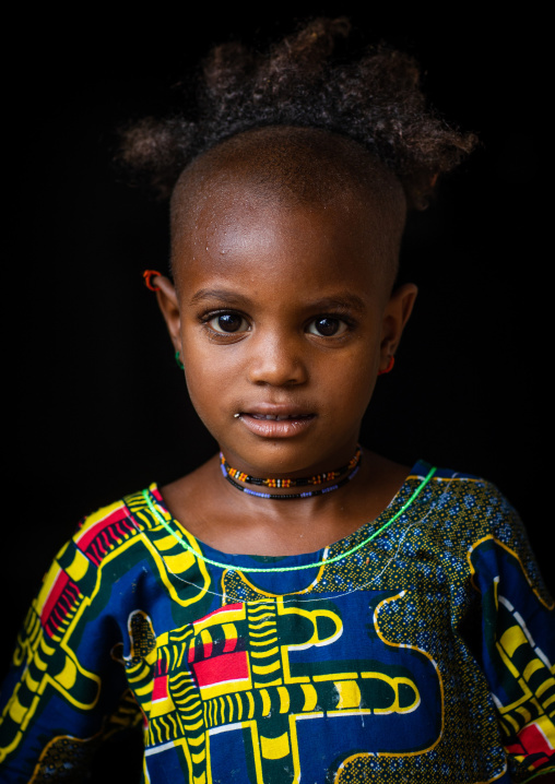 Portrait of a Peul tribe girl with a strange haircut, Savanes district, Boundiali, Ivory Coast