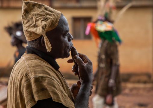 Senufo man using a flute during the Ngoro dance, Savanes district, Ndara, Ivory Coast