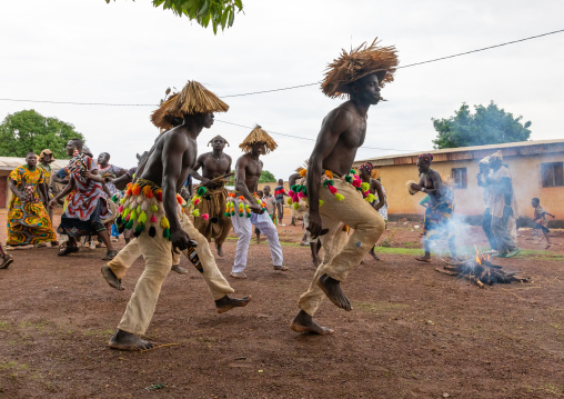 Senufo shirtless man dancing the Ngoro during a ceremony, Savanes district, Ndara, Ivory Coast