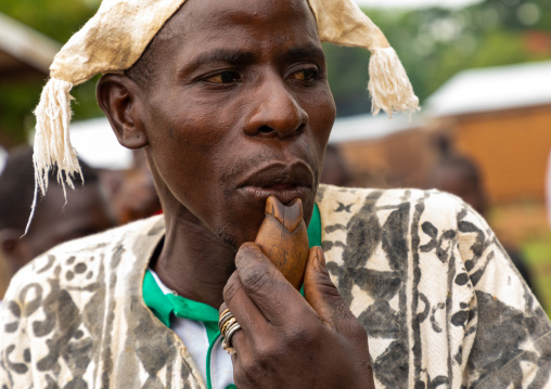 Senufo man using a flute during the Ngoro dance, Savanes district, Ndara, Ivory Coast