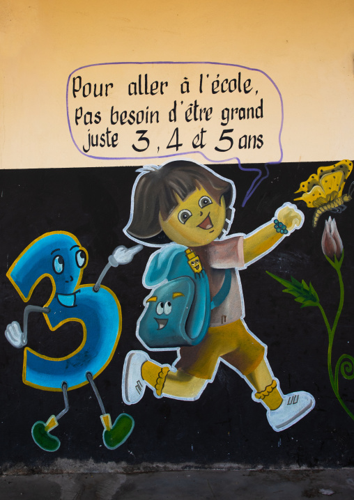 Billboard to promote that school starts at three years old for a child, Denguélé, Korondougou, Ivory Coast