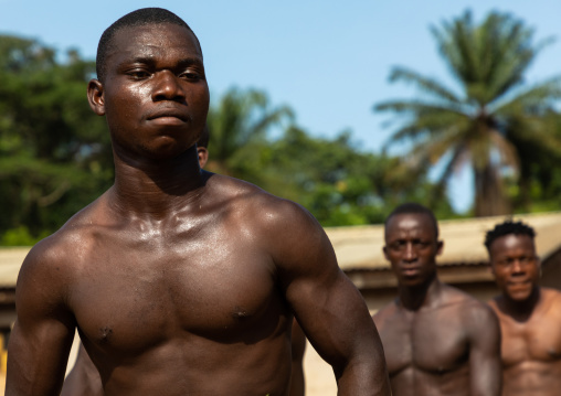 Dan tribe men dancing with leaves during a ceremony, Bafing, Gboni, Ivory Coast