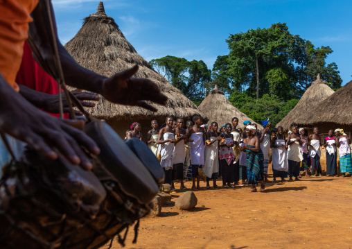 Dan tribe women in line singing and dancing during a ceremony, Bafing, Gboni, Ivory Coast