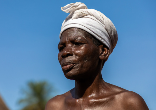Dan tribe senior woman dancing during a ceremony, Bafing, Gboni, Ivory Coast