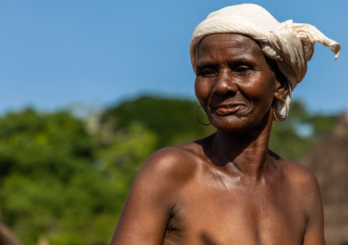 Dan tribe senior woman dancing during a ceremony, Bafing, Gboni, Ivory Coast