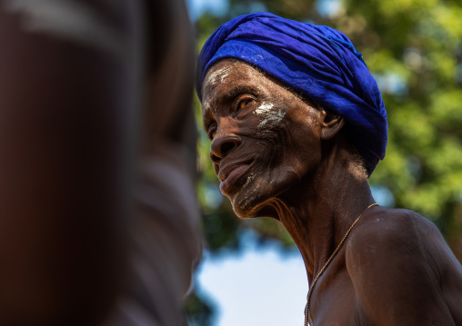 Dan tribe senior woman dancing during a ceremony, Bafing, Gboni, Ivory Coast