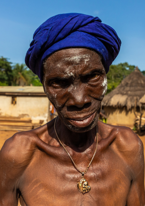 Dan tribe senior woman dancing during a ceremony, Bafing, Gboni, Ivory Coast