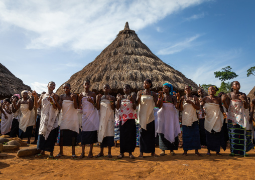 Dan tribe women in line singing and dancing during a ceremony, Bafing, Gboni, Ivory Coast