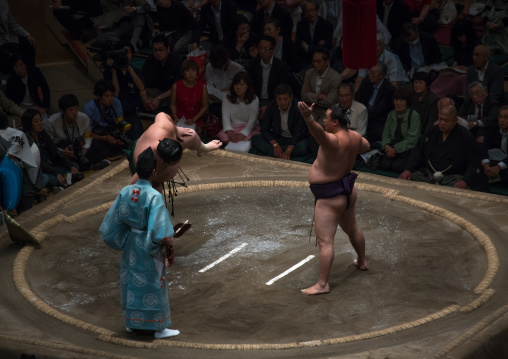Sumo wrestlers before the fight in the ryogoku kokugikan sumo arena, Kanto region, Tokyo, Japan