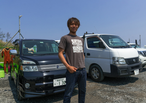 Japanese surfer in the contaminated area after the daiichi nuclear power plant irradiation, Fukushima prefecture, Tairatoyoma beach, Japan