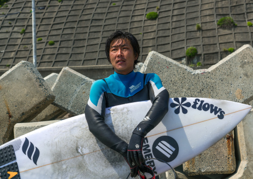 Japanese surfer in the contaminated area after the daiichi nuclear power plant irradiation, Fukushima prefecture, Tairatoyoma beach, Japan