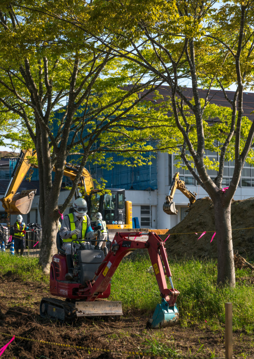 Decontamination work no entry sign in front of workers who remove top soil contaminated by nuclear radiations after the daiichi nuclear power plant explosion, Fukushima prefecture, Iitate, Ja
