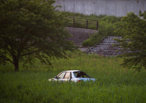 A destroyed and abandoned car by 2011 tsunami, Fukushima prefecture, Tomioka, Japan
