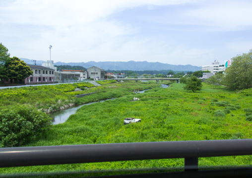 A destroyed and abandoned car by 2011 tsunami in the difficult-to-return zone, Fukushima prefecture, Tomioka, Japan