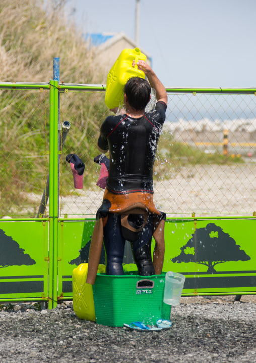 Japanese surfer in the contaminated area after the daiichi nuclear power plant irradiation, Fukushima prefecture, Tairatoyoma beach, Japan