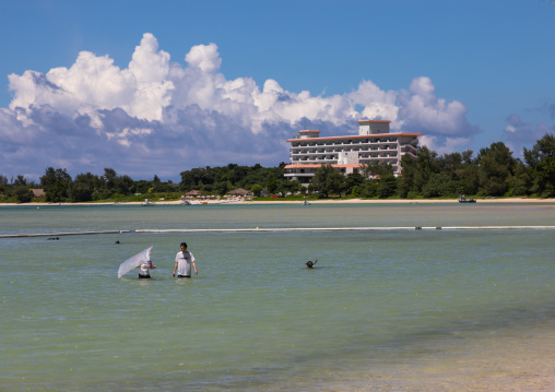 People having a bath in Sukuji beach inside anti-jellyfish net, Yaeyama Islands, Ishigaki, Japan