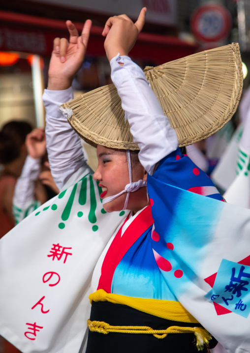 Japanese girl with straw hat during the Koenji Awaodori dance summer street festival, Kanto region, Tokyo, Japan
