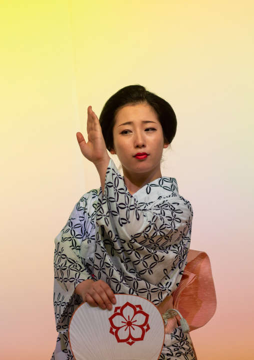 Maiko woman dancing on stage during a stage, Kansai region, Kyoto, Japan