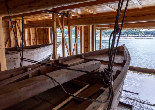 Traditional wooden boats parked inside a funaya house, Kyoto prefecture, Ine, Japan
