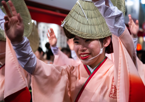 Japanese women with straw hats during the Koenji Awaodori dance summer street festival, Kanto region, Tokyo, Japan