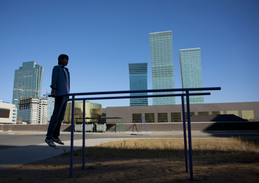 Boy Doing Gymnastics In A Courtyard, Astana, Kazakhstan
