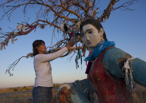 Woman Posting A Wish On A Tree On The Way To Burabay, Kazakhstan