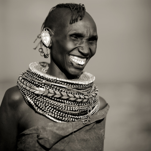 Turkana tribe woman with huge necklaces and earrings, Turkana lake, Loiyangalani, Kenya