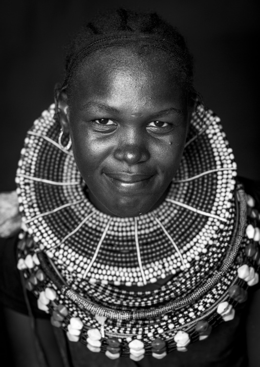 Turkana tribe woman with huge necklaces and ear rings, Turkana lake, Loiyangalani, Kenya