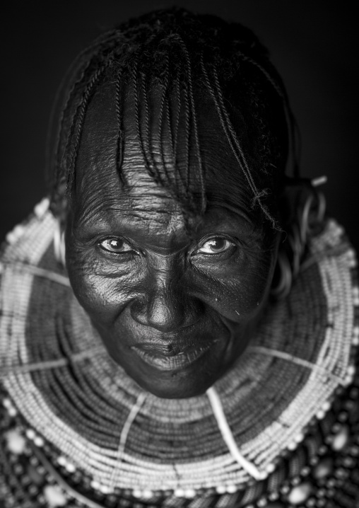 Turkana tribe woman with huge necklaces and earrings, Turkana lake, Loiyangalani, Kenya