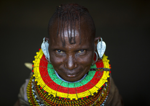 Turkana tribe woman with huge necklaces and earrings, Turkana lake, Loiyangalani, Kenya