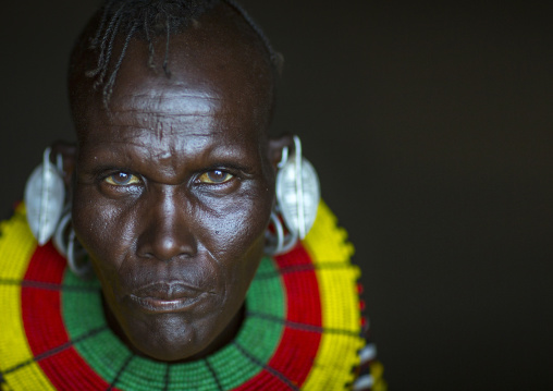 Turkana tribe woman with huge necklaces and earrings, Turkana lake, Loiyangalani, Kenya