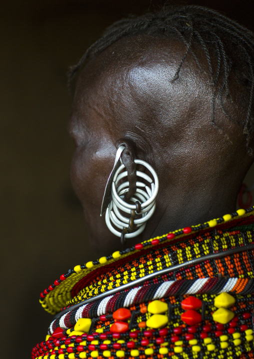 Turkana tribe woman with huge necklaces and earrings, Turkana lake, Loiyangalani, Kenya