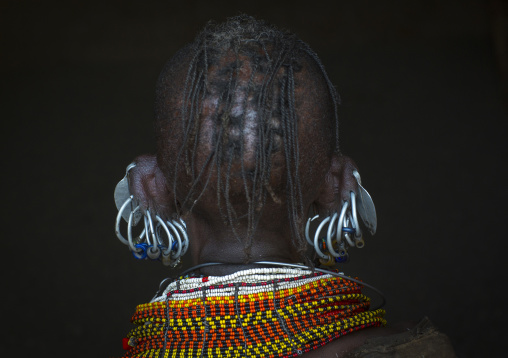 Turkana tribe woman with huge necklaces and earrings, Turkana lake, Loiyangalani, Kenya
