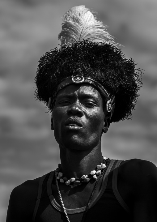Turkana tribesman with headwear made of ostrich black feathers, Turkana lake, Loiyangalani, Kenya