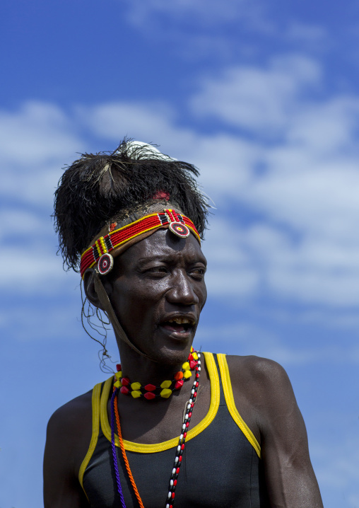 Turkana tribesman with headwear made of ostrich black feathers, Turkana lake, Loiyangalani, Kenya