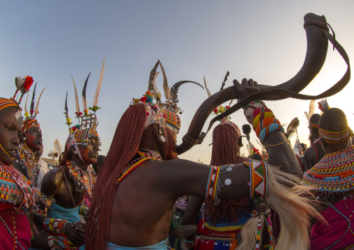 Rendille tribe man blowing in a horn, Turkana lake, Loiyangalani, Kenya