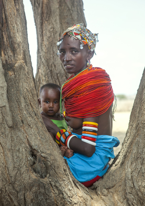 Rendille tribeswoman holding her baby, Marsabit district, Ngurunit, Kenya