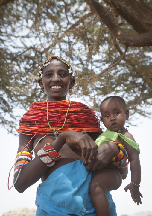 Rendille tribeswoman holding her baby, Marsabit district, Ngurunit, Kenya