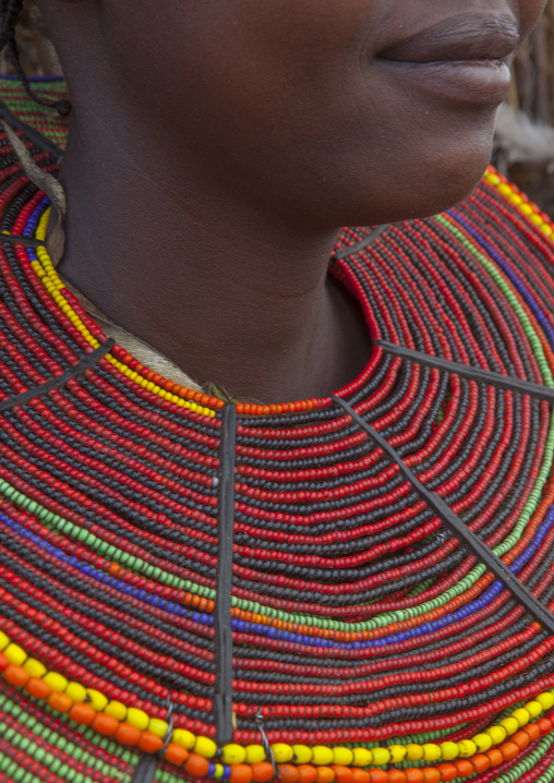 A pokot woman wears large necklaces made from the stems of sedge grass, Baringo county, Baringo, Kenya