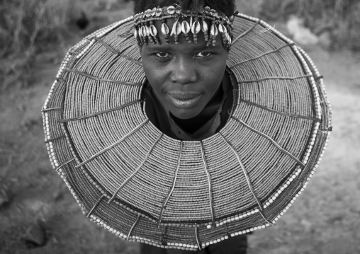 A pokot woman wears large necklaces made from the stems of sedge grass, Baringo county, Baringo, Kenya