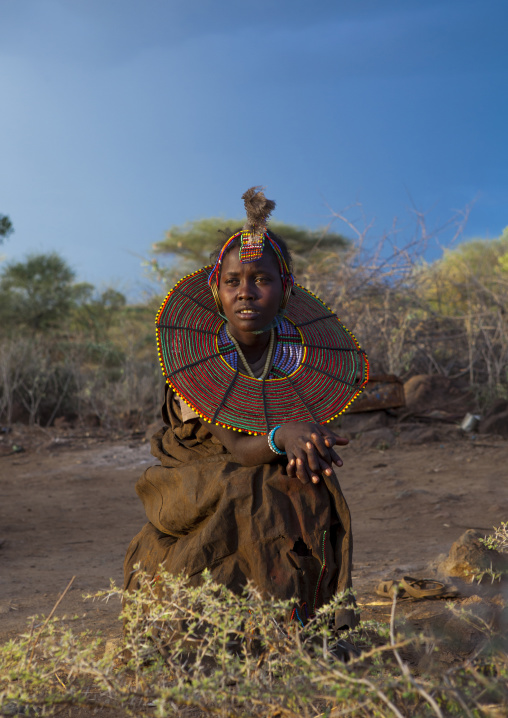A pokot girl wears large necklaces made from the stems of sedge grass, Baringo county, Baringo, Kenya