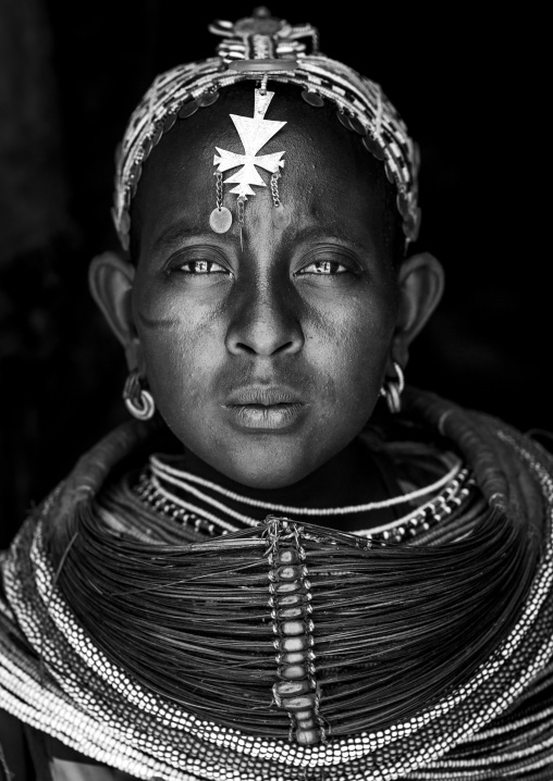 Rendille tribeswoman wearing traditional headdress and mpooro engorio necklace, Marsabit district, Ngurunit, Kenya