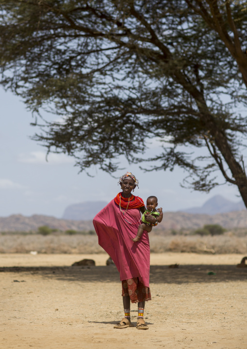 Rendille tribeswoman holding her baby, Marsabit district, Ngurunit, Kenya