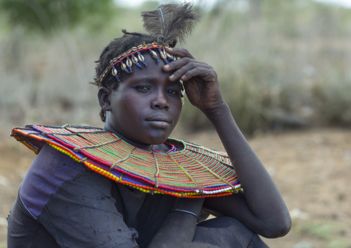 A pokot woman wears large necklaces made from the stems of sedge grass, Baringo county, Baringo, Kenya