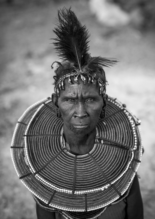 A pokot woman wears large necklaces made from the stems of sedge grass, Baringo county, Baringo, Kenya