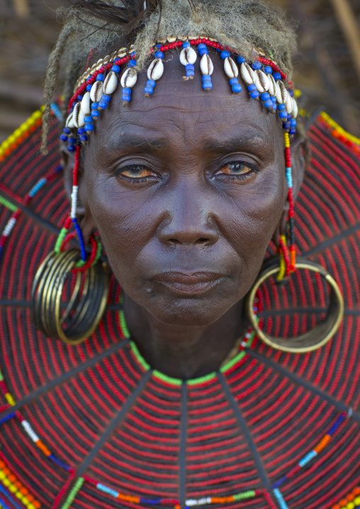 A pokot woman wears large necklaces made from the stems of sedge grass, Baringo county, Baringo, Kenya
