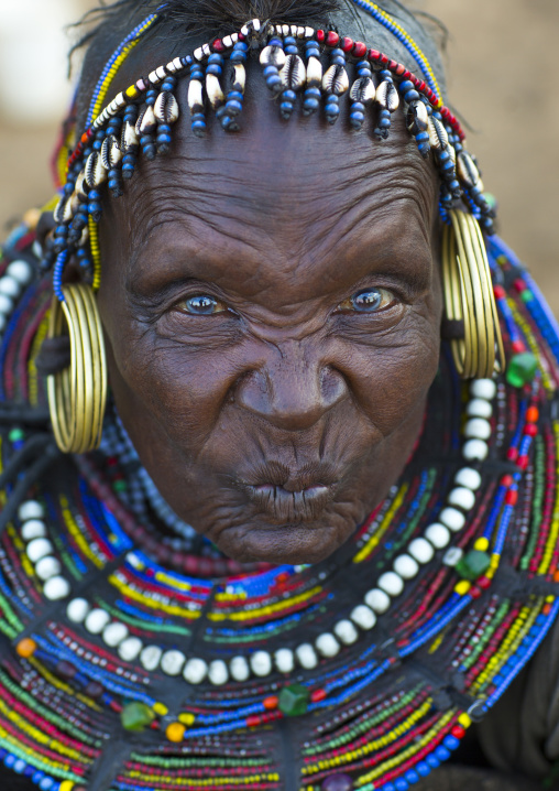 A pokot woman wears large necklaces made from the stems of sedge grass, Baringo county, Baringo, Kenya