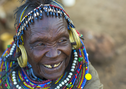 A pokot woman wears large necklaces made from the stems of sedge grass, Baringo county, Baringo, Kenya