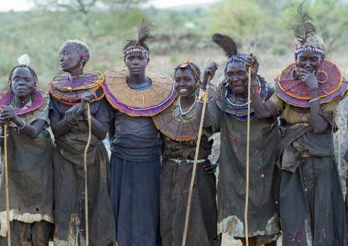 Group of pokot women wearing large necklaces made from the stems of sedge grass, Baringo county, Baringo, Kenya